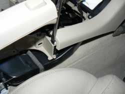 Disengaging the Center console from the lower radio trim